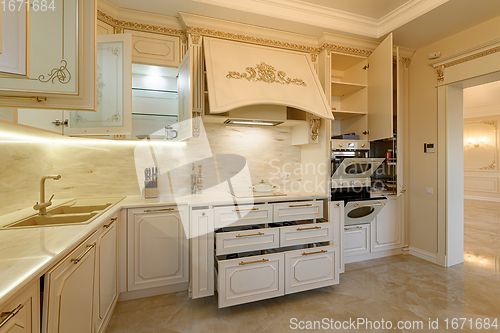 Image of Luxury beige and gold classic kitchen interior