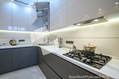 Image of Luxury white and dark grey modern kitchen interior