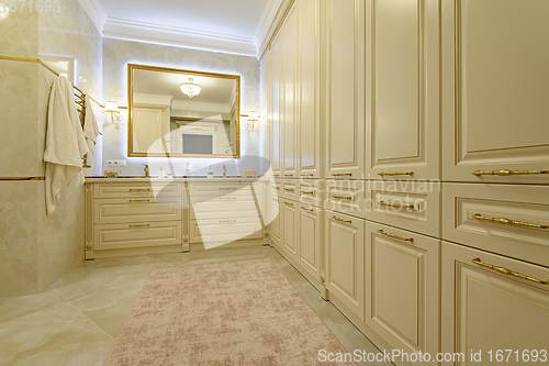 Image of Modern luxury beige and golden bathroom