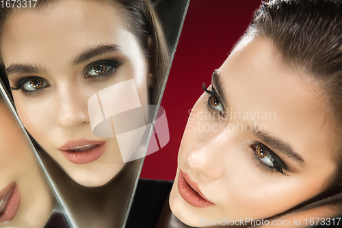 Image of Portrait of female fashion model with reflections on mirrors around her face. Style and beauty concept. Close up.