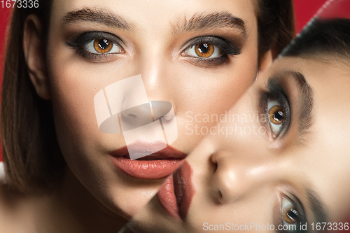 Image of Portrait of female fashion model with reflections on mirrors around her face. Style and beauty concept. Close up.