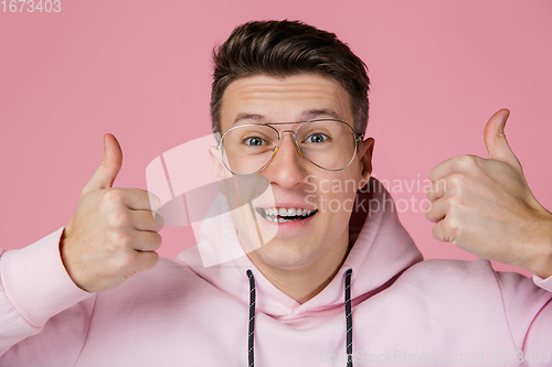 Image of Caucasian man\'s portrait isolated on pink studio background with copyspace