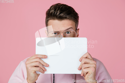 Image of Caucasian man\'s portrait isolated on pink studio background with copyspace