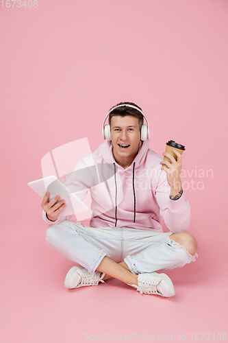 Image of Caucasian man\'s portrait isolated on pink studio background with copyspace