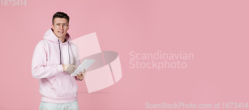 Image of Caucasian man\'s portrait isolated on pink studio background with copyspace