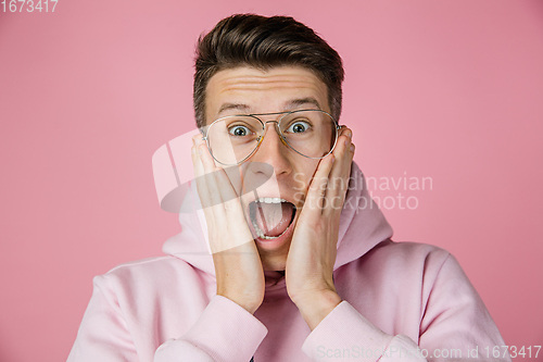 Image of Caucasian man\'s portrait isolated on pink studio background with copyspace