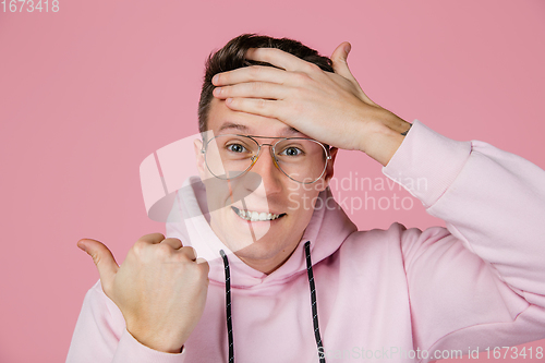 Image of Caucasian man\'s portrait isolated on pink studio background with copyspace