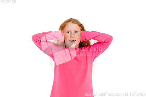 Image of Happy redhair girl isolated on white studio background. Looks happy, cheerful, sincere. Copyspace. Childhood, education, emotions concept