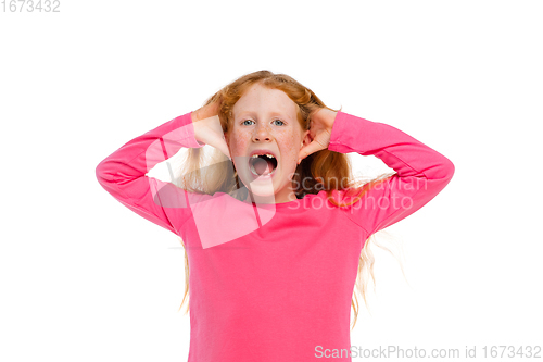 Image of Happy redhair girl isolated on white studio background. Looks happy, cheerful, sincere. Copyspace. Childhood, education, emotions concept