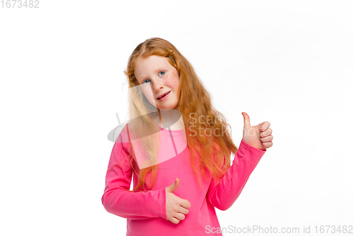 Image of Happy redhair girl isolated on white studio background. Looks happy, cheerful, sincere. Copyspace. Childhood, education, emotions concept