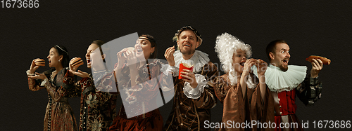 Image of Medieval people as a royalty persons in vintage clothing on dark background. Concept of comparison of eras, modernity and renaissance, baroque style.