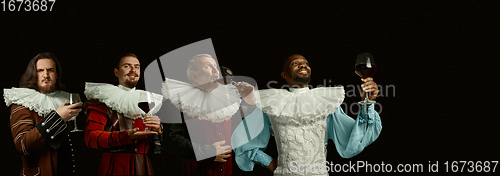 Image of Medieval men as a royalty persons in vintage clothing on dark background. Concept of comparison of eras, modernity and renaissance, baroque style.