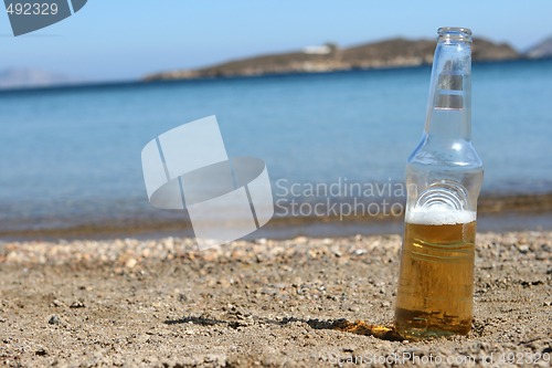 Image of beer on the beach