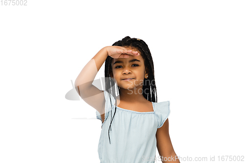 Image of Happy longhair brunette little girl isolated on white studio background. Looks happy, cheerful, sincere. Copyspace. Childhood, education, emotions concept