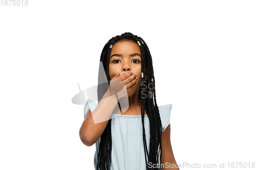 Image of Happy longhair brunette little girl isolated on white studio background. Looks happy, cheerful, sincere. Copyspace. Childhood, education, emotions concept