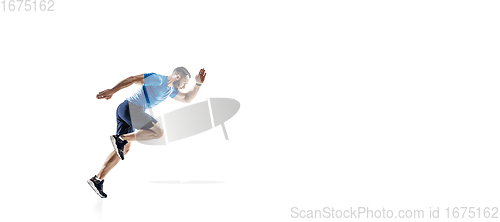 Image of Caucasian professional male runner, athlete training isolated on white studio background. Copyspace for ad.