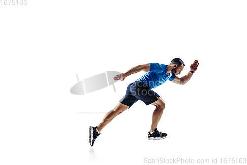 Image of Caucasian professional male runner, athlete training isolated on white studio background. Copyspace for ad.