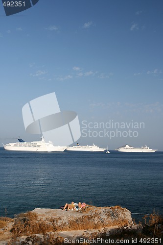 Image of ships and tourist