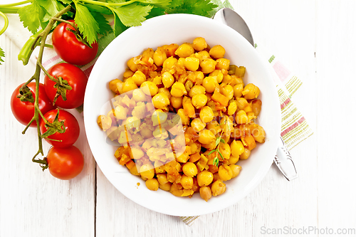 Image of Chickpeas with vegetables stewed in plate on light board top