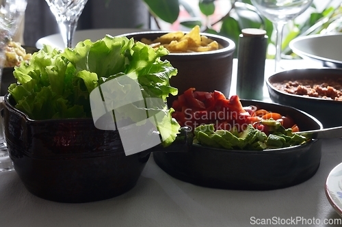 Image of green salad and side dish