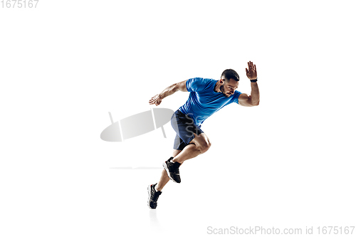 Image of Caucasian professional male runner, athlete training isolated on white studio background. Copyspace for ad.