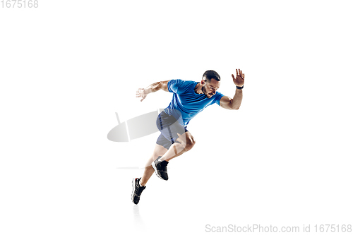 Image of Caucasian professional male runner, athlete training isolated on white studio background. Copyspace for ad.