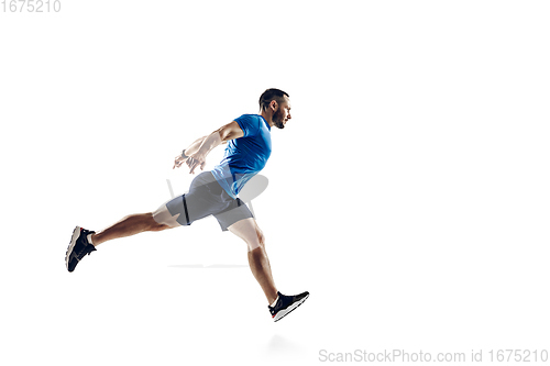 Image of Caucasian professional male runner, athlete training isolated on white studio background. Copyspace for ad.