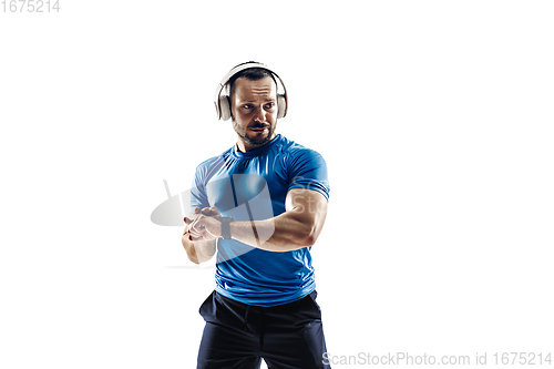 Image of Caucasian professional male runner, athlete training isolated on white studio background. Copyspace for ad.