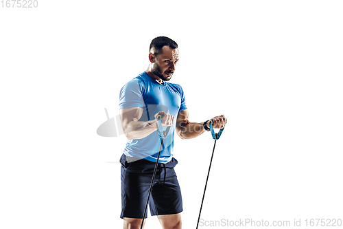 Image of Caucasian professional male runner, athlete training isolated on white studio background. Copyspace for ad.