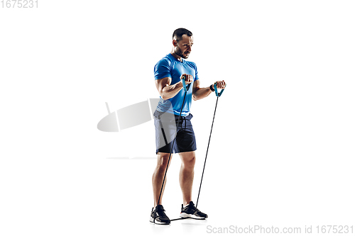 Image of Caucasian professional male runner, athlete training isolated on white studio background. Copyspace for ad.