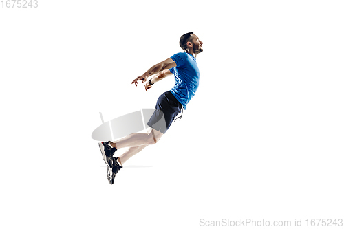 Image of Caucasian professional male runner, athlete training isolated on white studio background. Copyspace for ad.