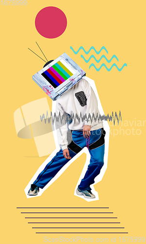 Image of Young man dancer headed of tv set dancing isolated on yellow background.