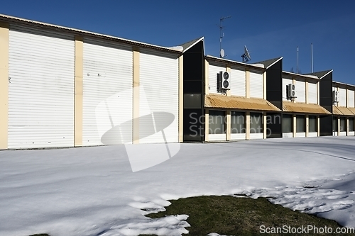 Image of abandoned non residential building in winter, deadpan photograph