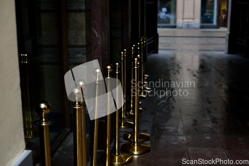 Image of doorway in the city and gilt fence posts