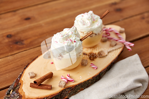 Image of glasses of eggnog with whipped cream and anise