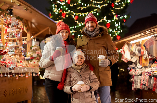 Image of family with takeaway drinks at christmas market