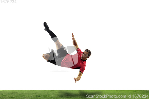 Image of Young football, soccer player of team in action, motion isolated on white background. Concept of sport, movement, energy and dynamic.