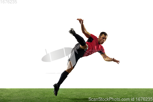 Image of Young football, soccer player of team in action, motion isolated on white background. Concept of sport, movement, energy and dynamic.