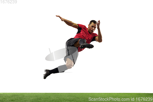 Image of Young football, soccer player of team in action, motion isolated on white background. Concept of sport, movement, energy and dynamic.