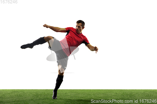 Image of Young football, soccer player of team in action, motion isolated on white background. Concept of sport, movement, energy and dynamic.