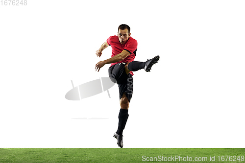 Image of Young football, soccer player of team in action, motion isolated on white background. Concept of sport, movement, energy and dynamic.