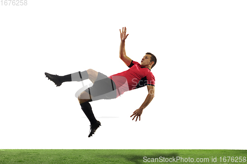 Image of Young football, soccer player of team in action, motion isolated on white background. Concept of sport, movement, energy and dynamic.