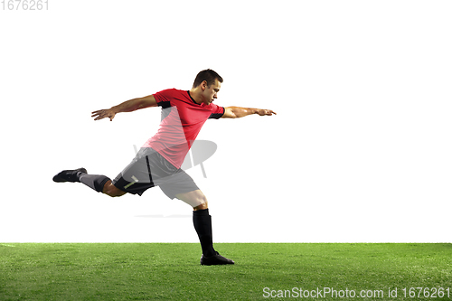 Image of Young football, soccer player of team in action, motion isolated on white background. Concept of sport, movement, energy and dynamic.