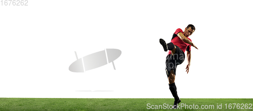 Image of Young football, soccer player of team in action, motion isolated on white background. Concept of sport, movement, energy and dynamic.