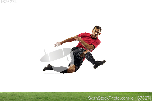 Image of Young football, soccer player of team in action, motion isolated on white background. Concept of sport, movement, energy and dynamic.