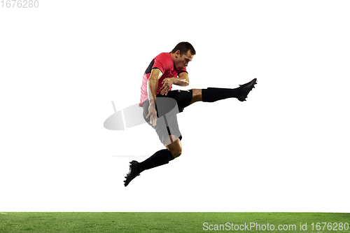 Image of Young football, soccer player of team in action, motion isolated on white background. Concept of sport, movement, energy and dynamic.