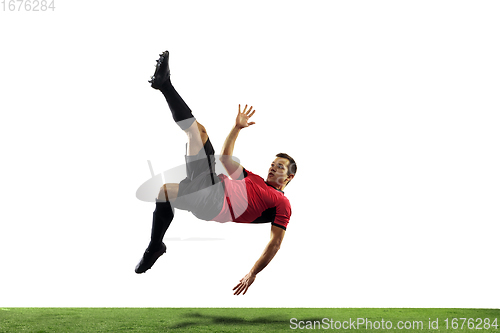Image of Young football, soccer player of team in action, motion isolated on white background. Concept of sport, movement, energy and dynamic.