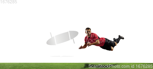 Image of Young football, soccer player of team in action, motion isolated on white background. Concept of sport, movement, energy and dynamic.
