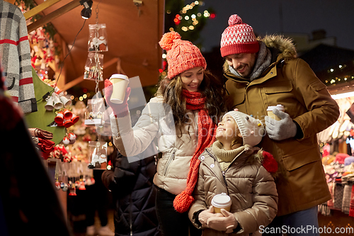 Image of family with takeaway drinks at christmas market