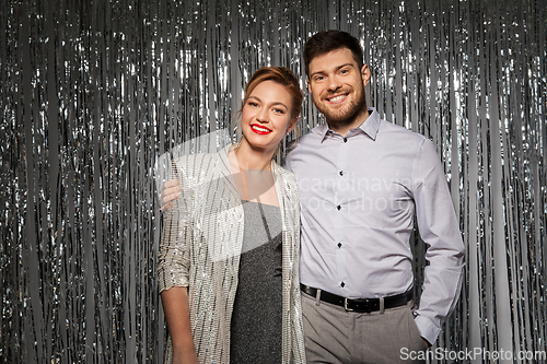 Image of happy hugging couple in party clothes